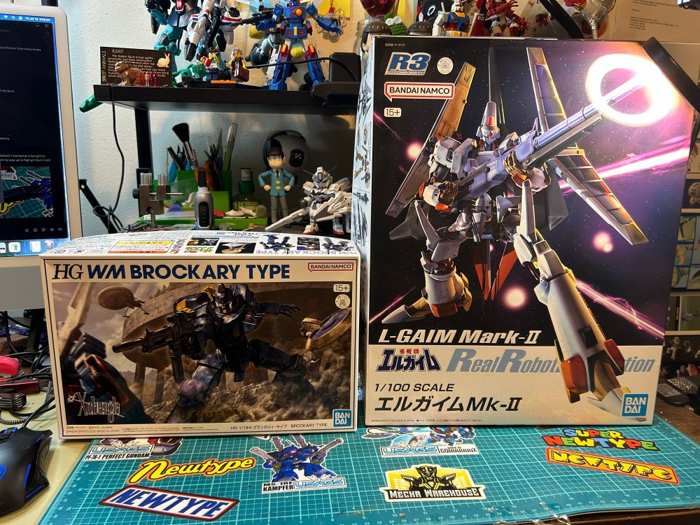Picture of the High Grade Walker Machine Brockary Type and the Real Robot Revolution L-Gaim Mark II boxes sitting on my desk side by side.