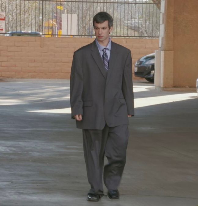 A picture of Nathan fielder in an ill-fitted suit 