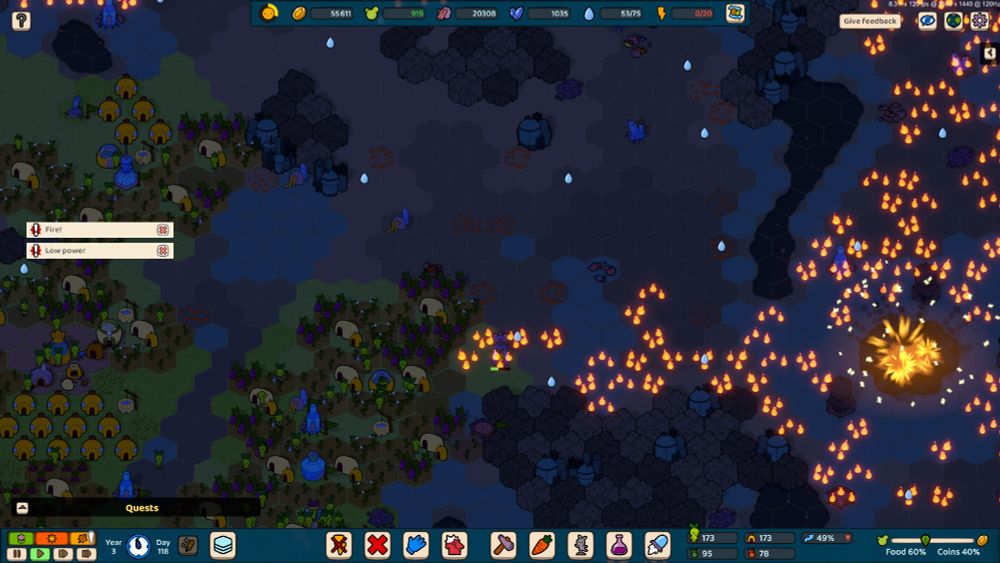 A screenshot of the indie strategy game Green Again depicting a night scene where a big area on the right is on fire. Flames light up the night scenery and a big foundry building is erupting in orange flames.