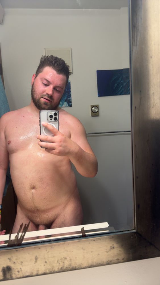 Me standing naked in the mirror drenched in sweat
