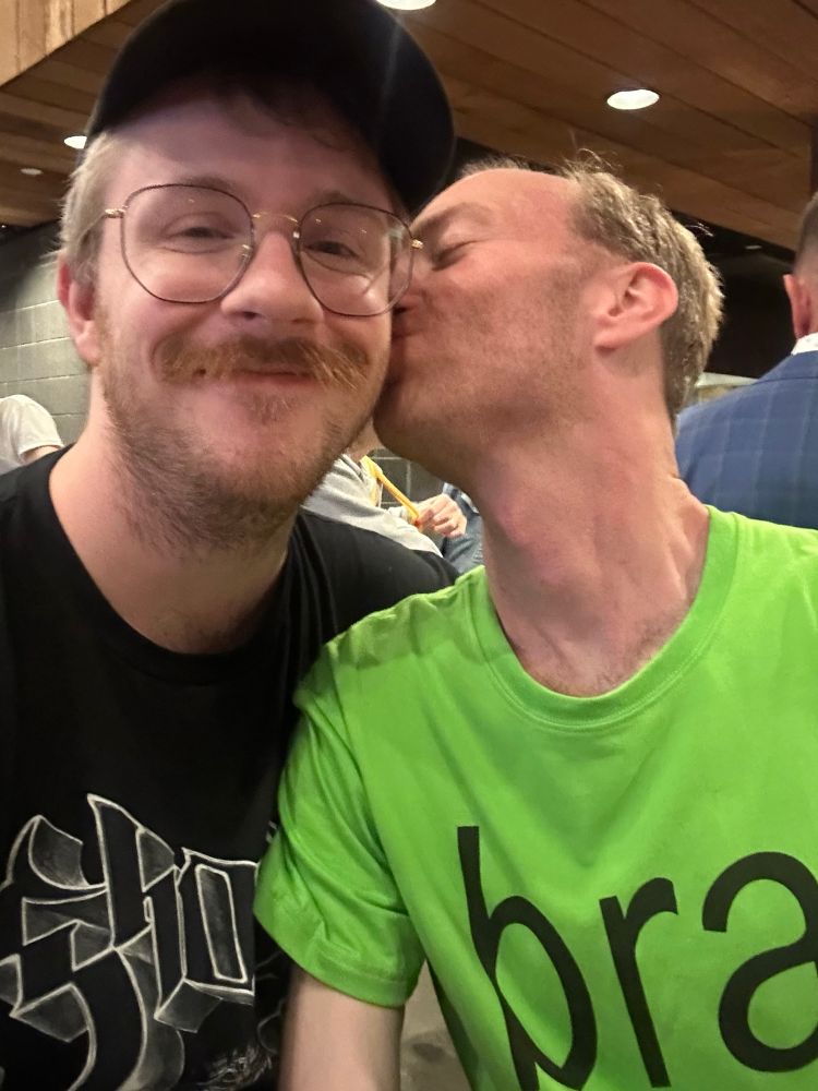 same as the prior photo, but my boyfriend is kissing my cheek and i am cheesy-smiling