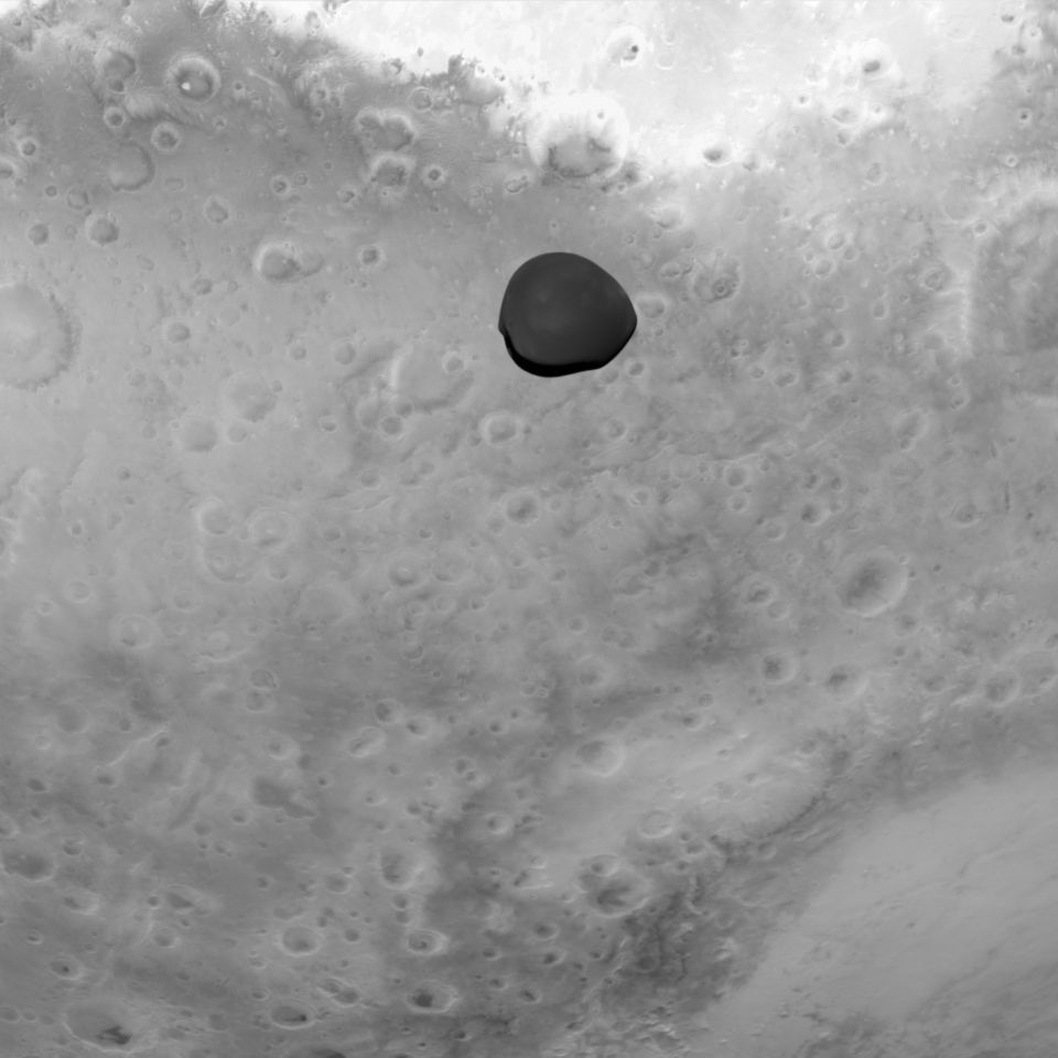 A black and white image of Mars and Deimos, viewed through Hera's Asteroid Framing Camera.