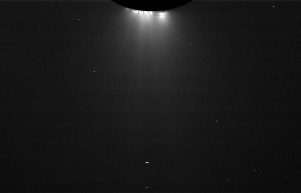 Image of Enceladus at the top, with white glowing plumes of water spraying out into space.