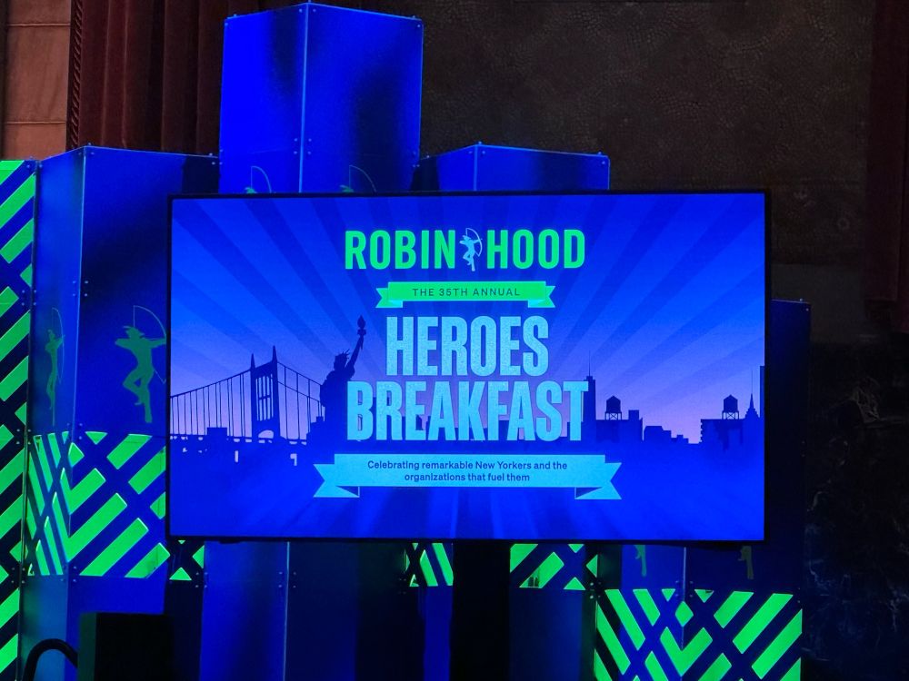 TV screen with Robin Hood Heroes Breakfast on it 