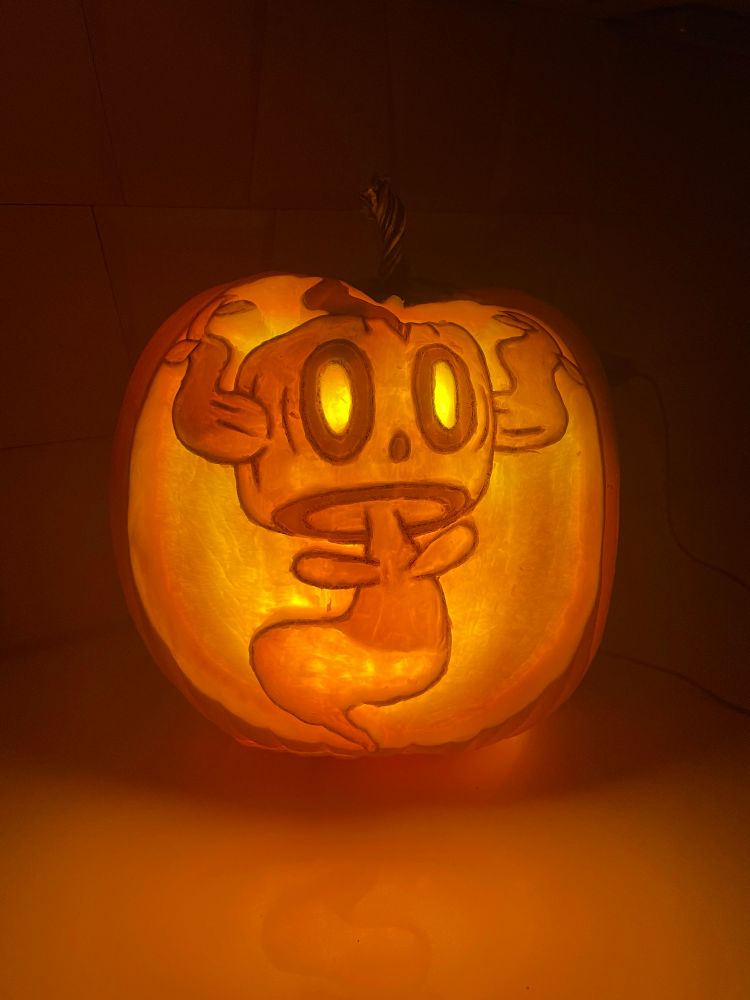 a pumpkin carving of the pokémon phantump 