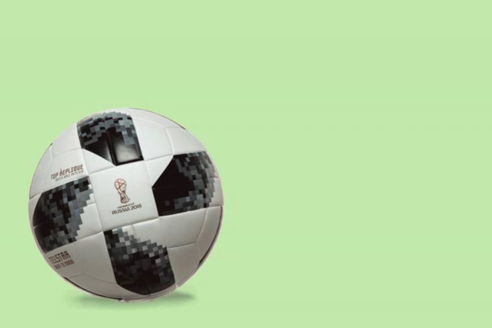 a person is pumping a soccer ball that says world cup russia 2018