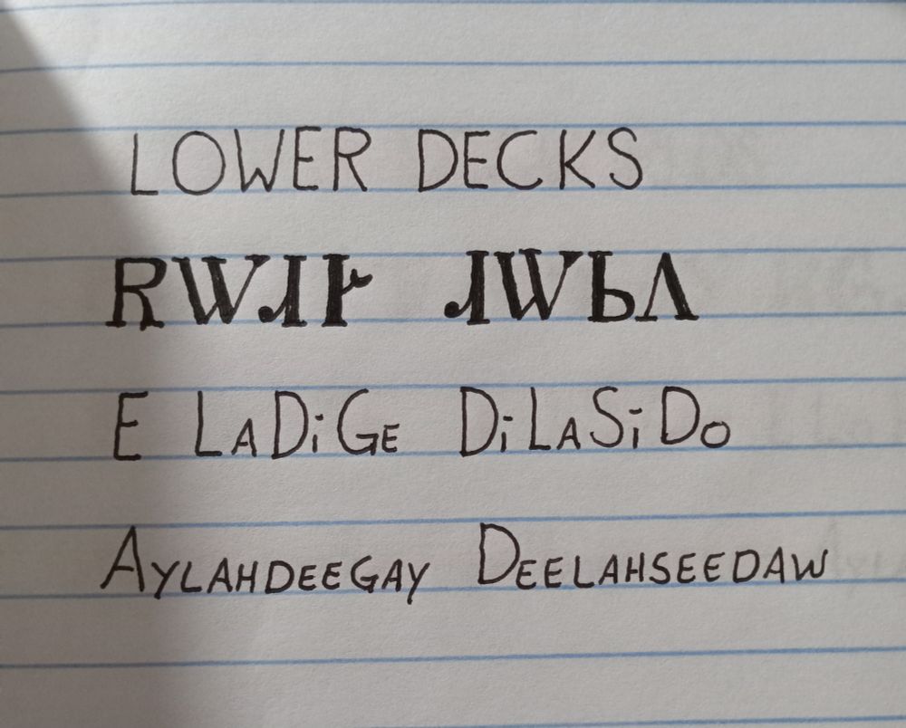 Image is line paper with writing showing an English word followed by how it is written in the Cherokee language followed by how it is spelled and pronounced. The words are lower decks and pronounced aylahdeegay deelahseedaw