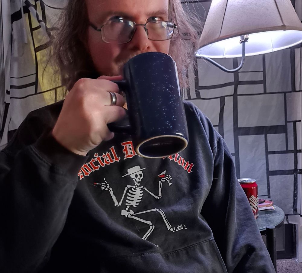 Drinking from the blue cup shows a blank side forward with the text removed.