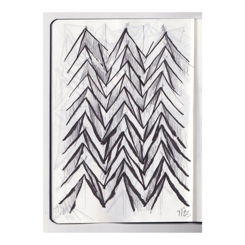 an ink sketchbook drawing of three columns of zigzagging triangular peaks