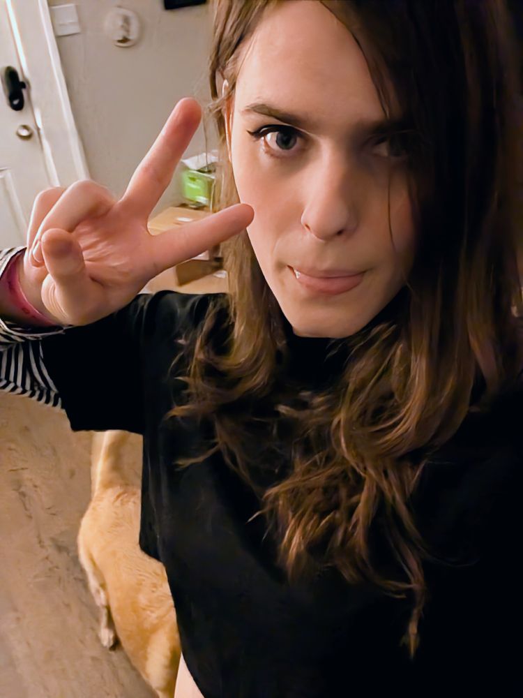 Willow in some simple makeup and a black shirt. What a cutie!