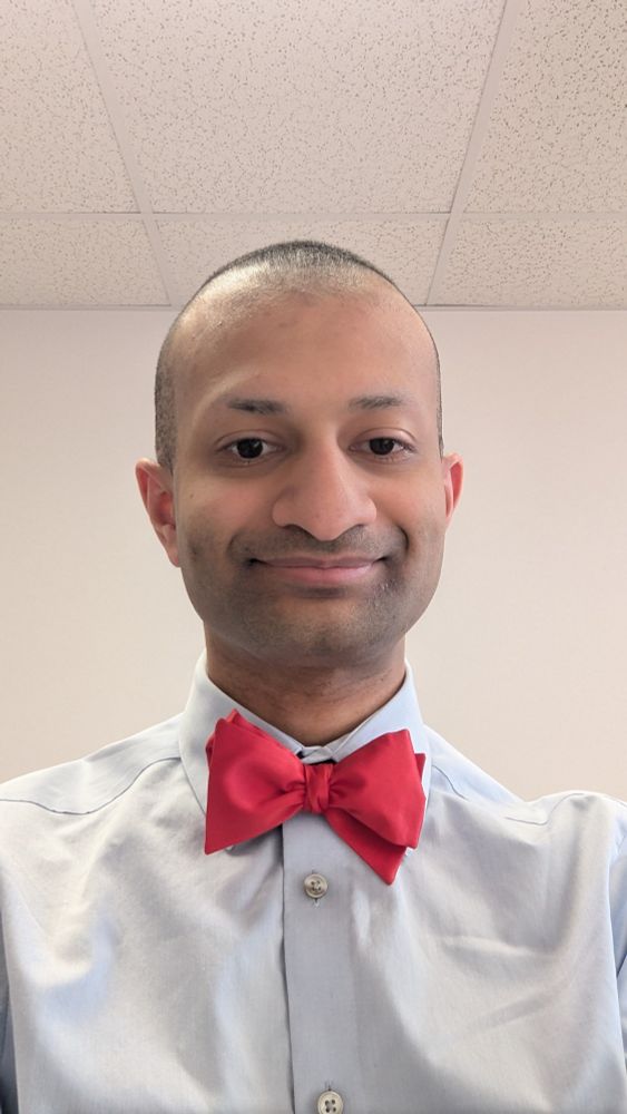 The poster, in light blue shirt and red bowtie, celebrating his fellowship match and the opportunity to interview applicants to his Med-Peds residency program.