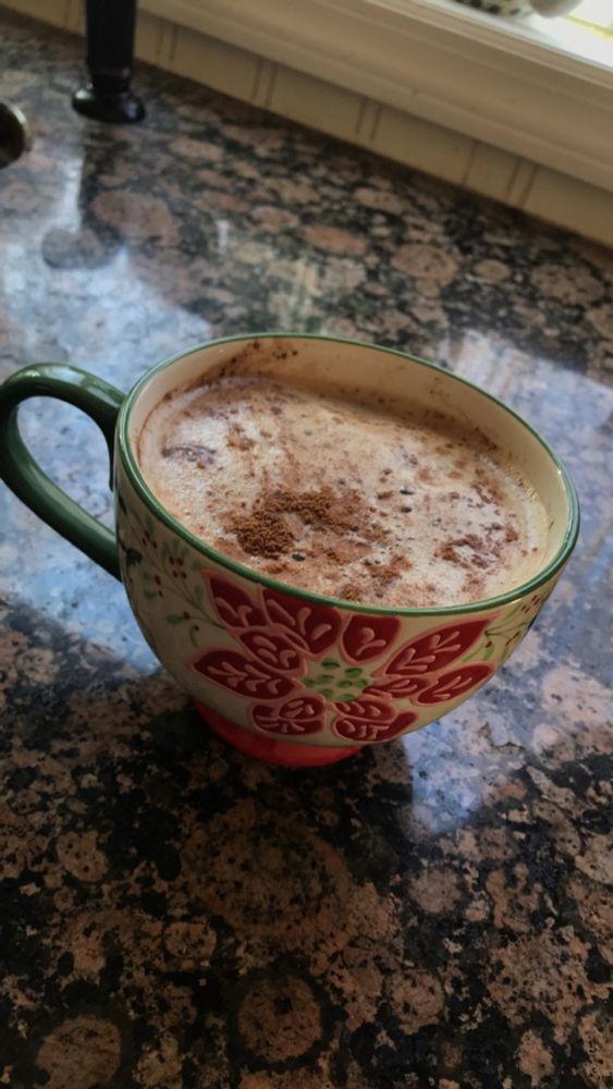 Poinsettia mug with coffee. 