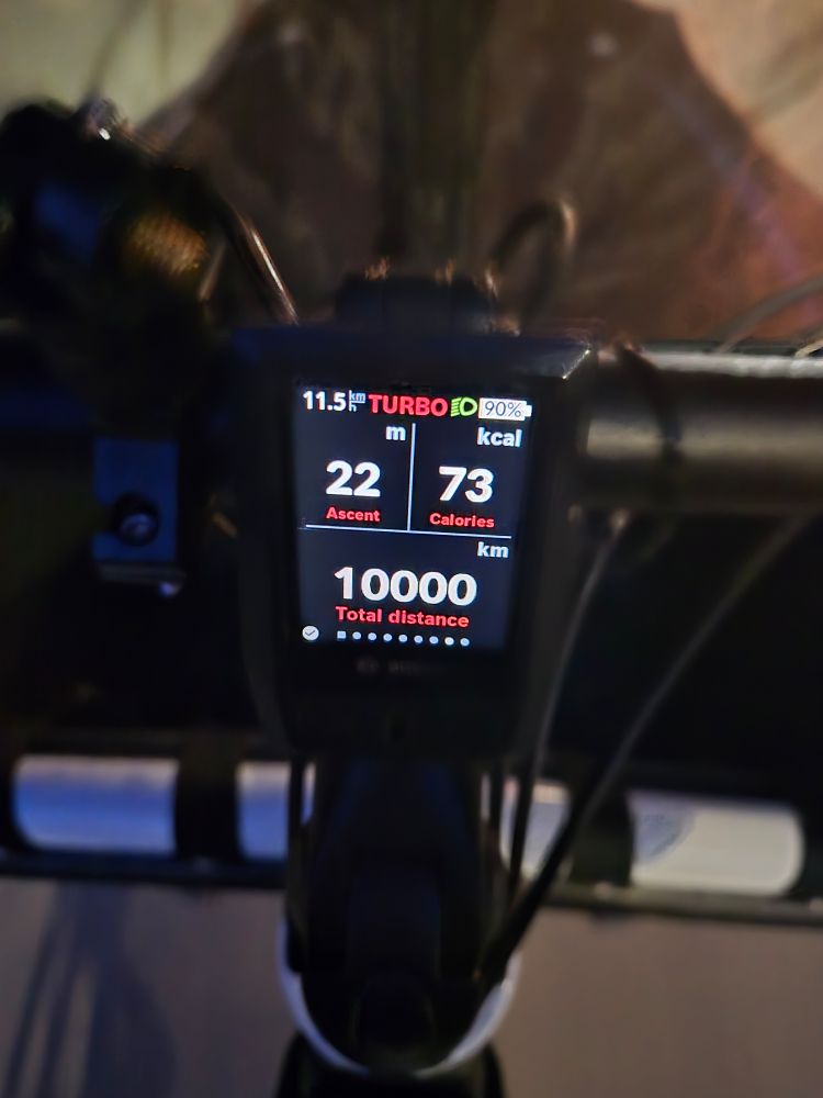Picture of a black ebike display reading 10,000km