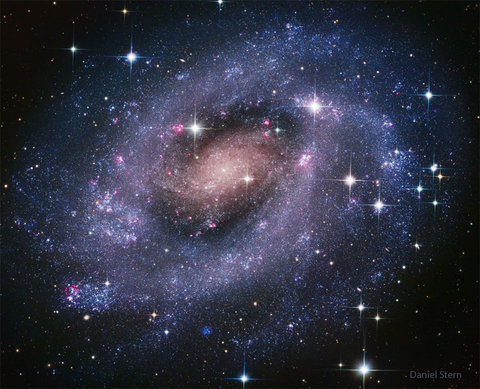 This captivating image features the spectacular spiral galaxy NGC 300, also known as Caldwell 70 or the Sculptor Pinwheel Galaxy. What is striking about the image is the extraordinary abundance of stars that can be seen. NGC 300 contains, in fact, many young hot blue stars, massive and very bright, dominating the outer spiral arms; they stand out very well in the image, contributing to the visibility of the galaxy.