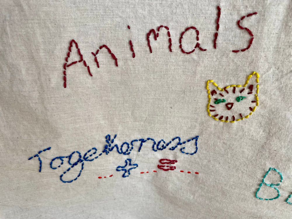 Embroidered words on calico