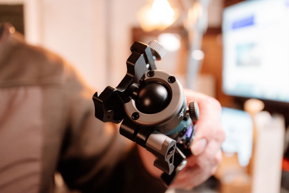 Image of the Mambapod, a sleek and compact travel tripod made of durable metal. The tripod is shown in its folded state, highlighting its portability. Designed for versatility, it features unique modes such as clamp, hook, and handheld, making it ideal for city photographers and vloggers. This innovative product is currently being showcased on a Kickstarter campaign