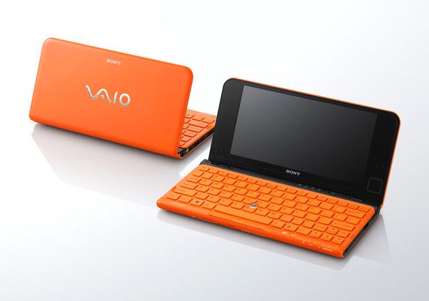 An orange tiny Sony laptop computer from 2010