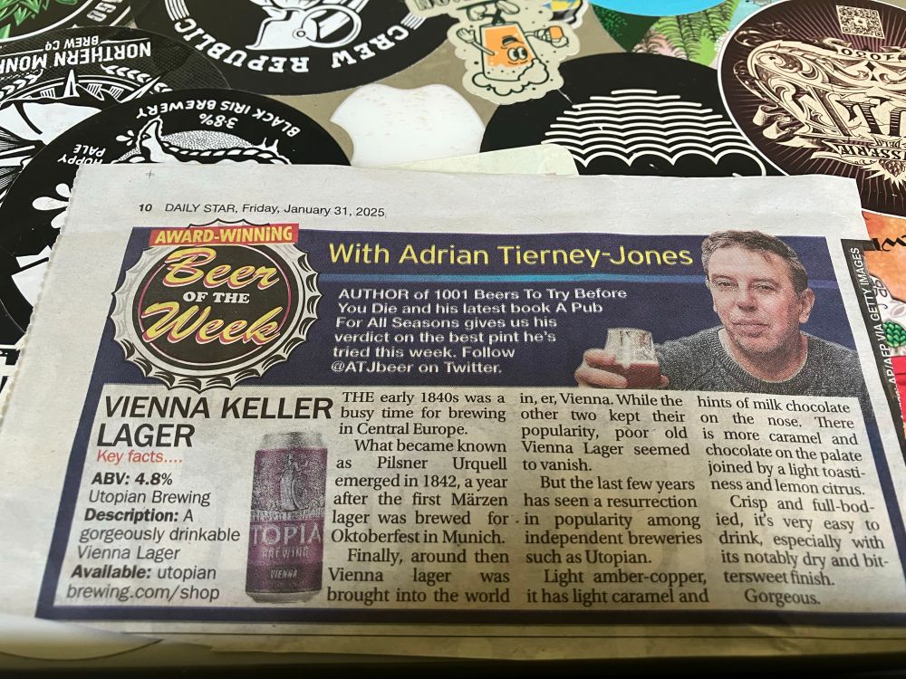 Newspaper cutting of beer if the week featuring Utopian’s Vienna, resting on top of laptop 
