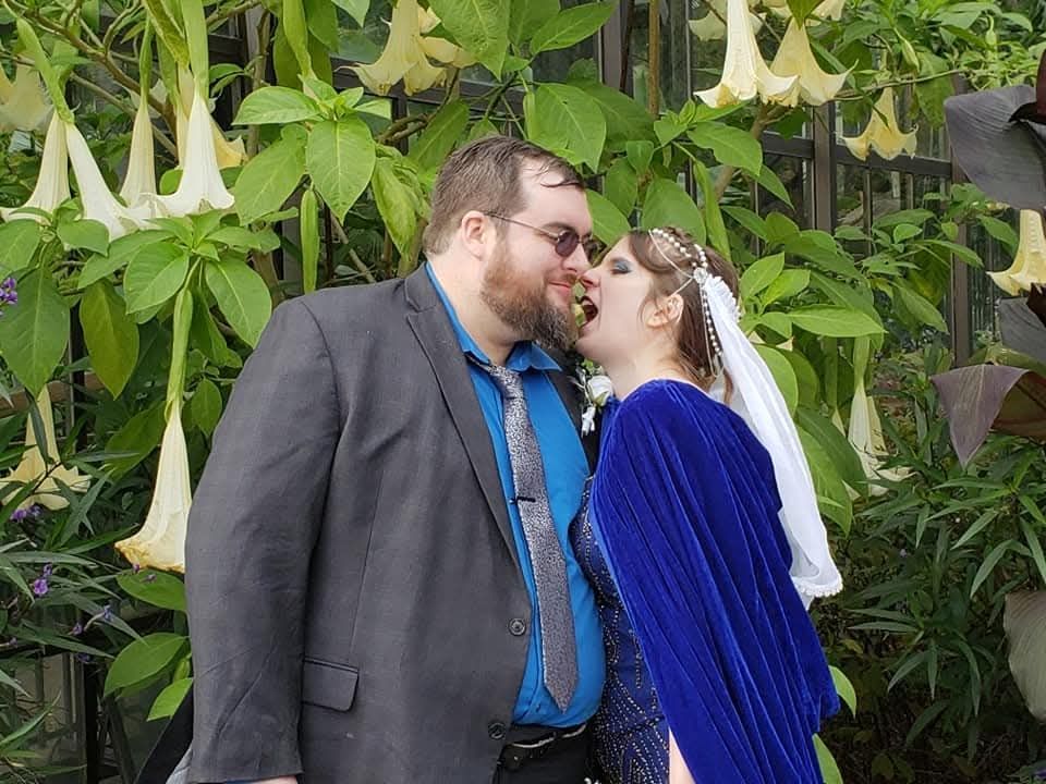 Jax bites Ben at the water lily gardens at Longwood Gardens 