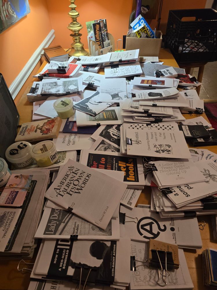 the dupes table where people can take their own copies of zines in the library!!