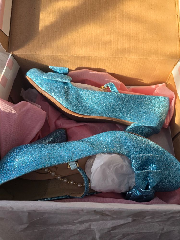 side view of Cinderella blue heels with bows