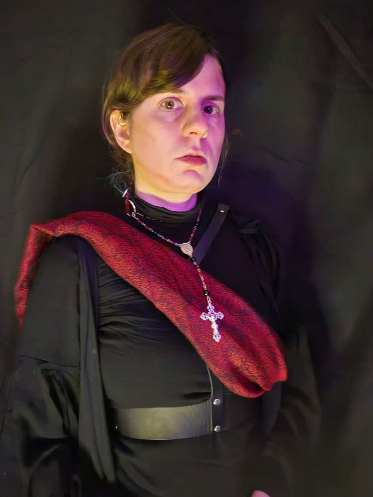 Jax looks intensely at the mirror in pinkish light