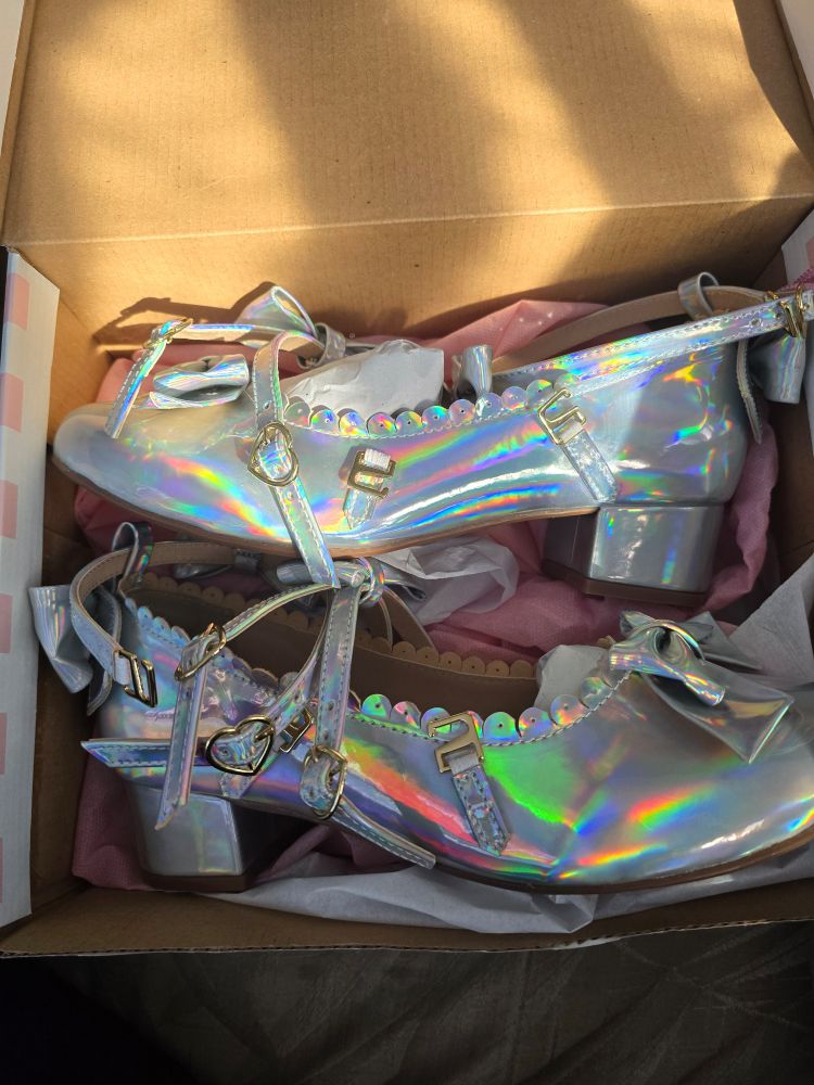 side view of silver holographic leather shoes