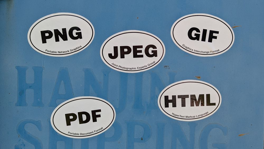 Oval stickers that look like those Euro place stickers except they say PNG (Portable Network Graphics) JPEG (Join Photographic Experts Group) GIF (Graphics Exchange Format) PDF (Portable Document Format) AND HTML (HyperText Markup Language)