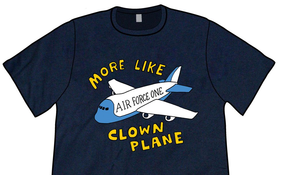 Navy Blue Shirt: A really good drawing of a plane that says AIR FORCE ONE on it, with the caption MORE LIKE CLOWN PLANE