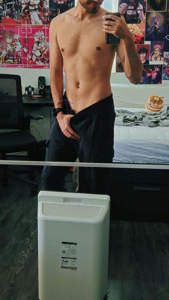 Mirror pic pulling down black sweatpants dangerously low while being shirtless so v-lines go brrr