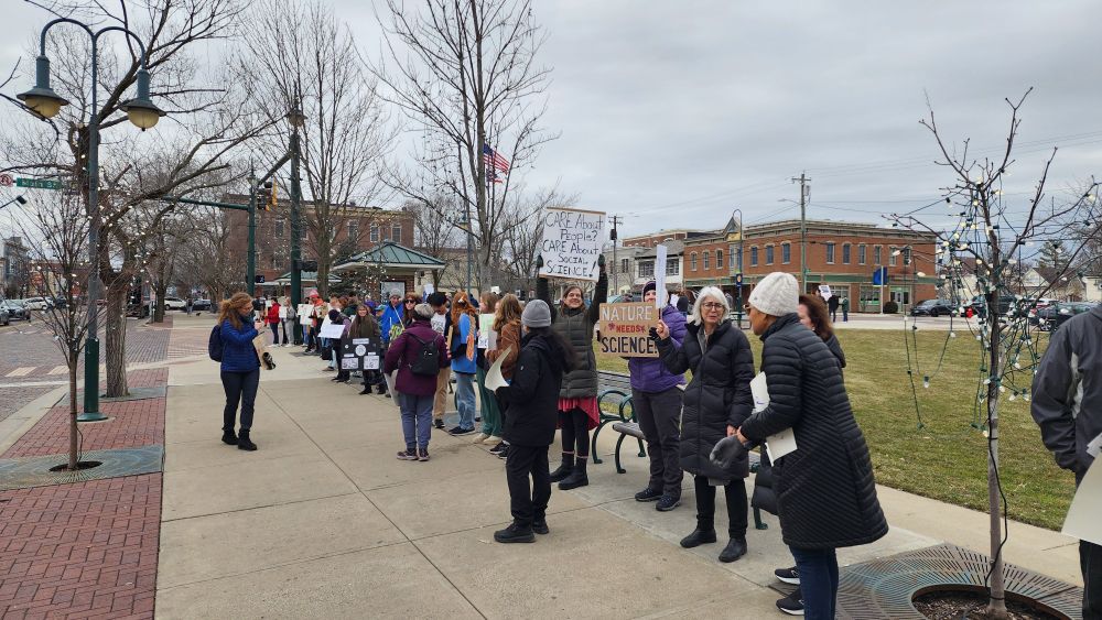 Rally supporters holding signs in support of stand up for science.