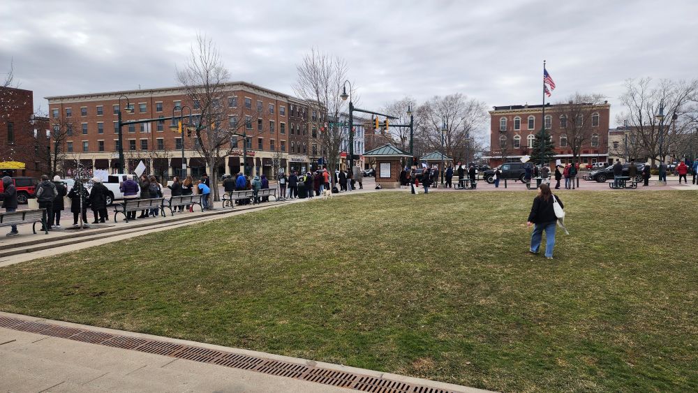 Rally supporters holding signs in support of stand up for science alon the sidewalks around two blocks in the center of Oxford, Ohio.
