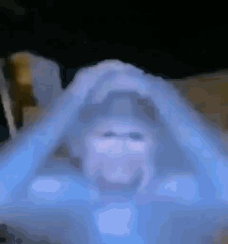 a blurry picture of a person 's face with a blue glow