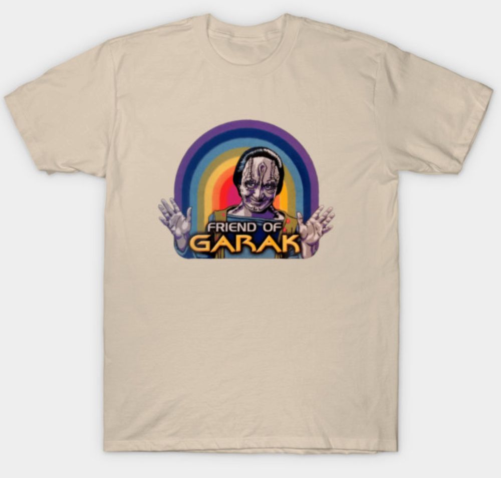 Picture of a t-shirt with an image of Garak from Star Trek: Deep Space Nince, a rainbow behind him, and text that reads "Friend of Garak."