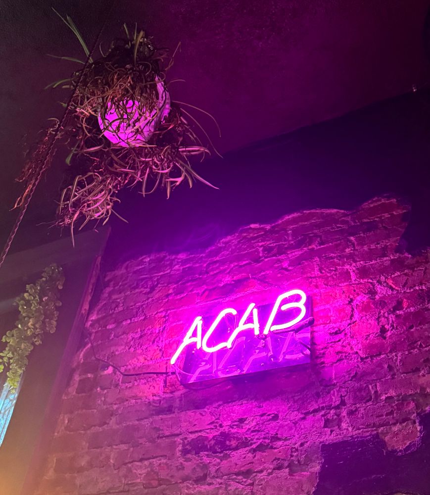 Neon ACAB sign at GLC