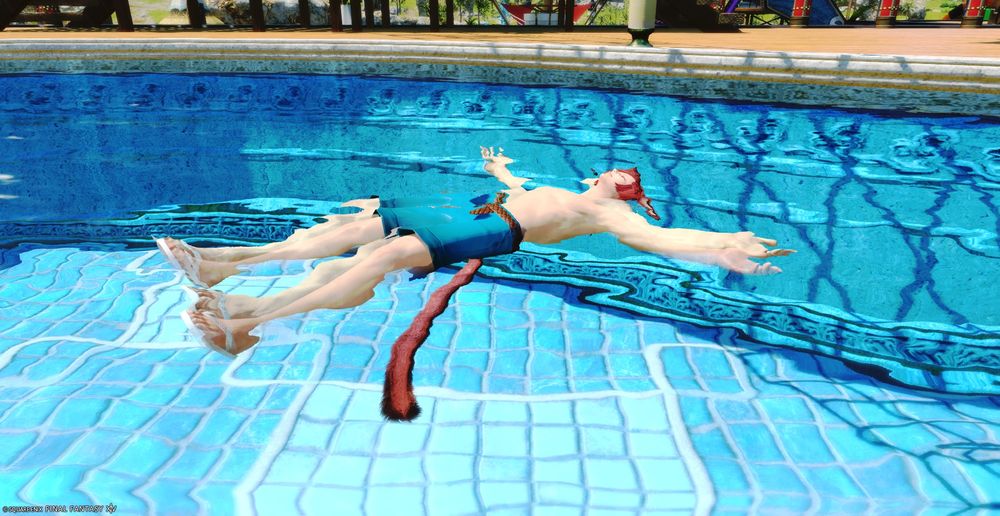 G'raha Tia floating in the pool during the Moonfire Faire.