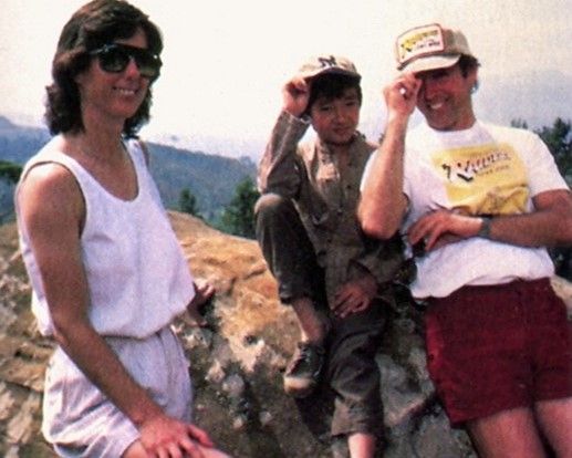 Kathleen Kennedy, Ke Huy Quan, and Harrison Ford on the set of "Indiana Jones and the Temple of Doom" (1984).