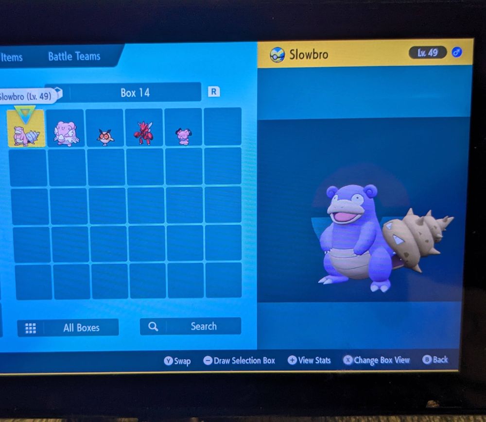 A screenshot of my Pokemon Violet game screen, showing a box of only shiny pokemon; Slowbro, Blissey, Hoothoot, Scizor and Snubbull. 