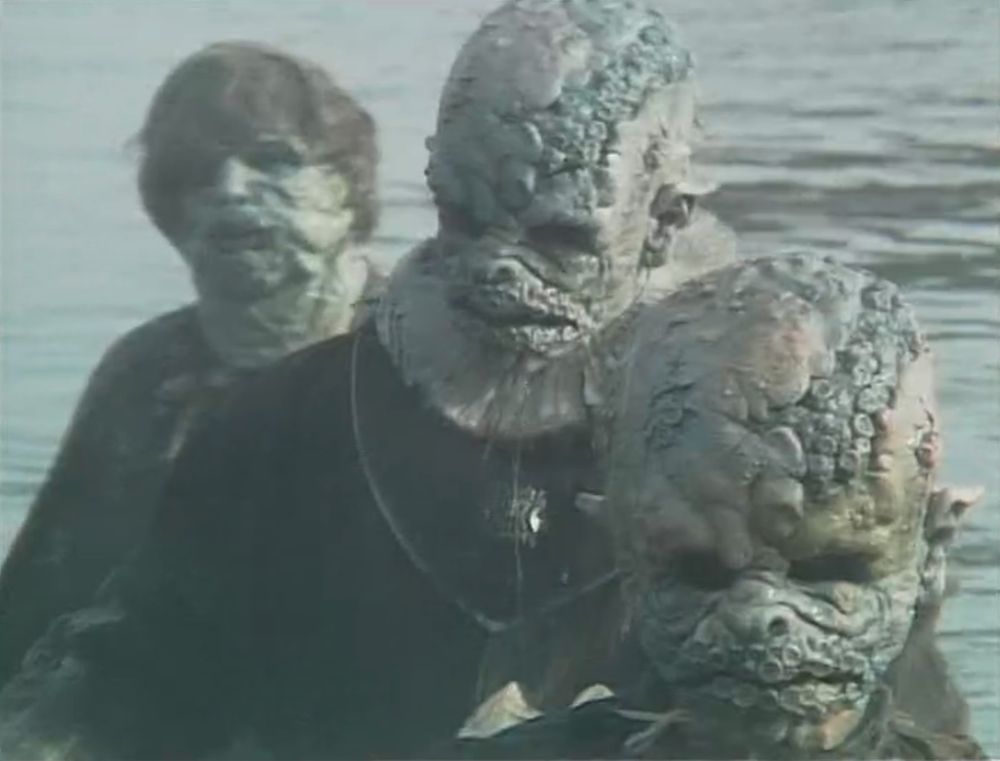 Monstrous blue sucker-covered Haemovores rise from the sea at the cliffhanger of The Curse of Fenric Part Two