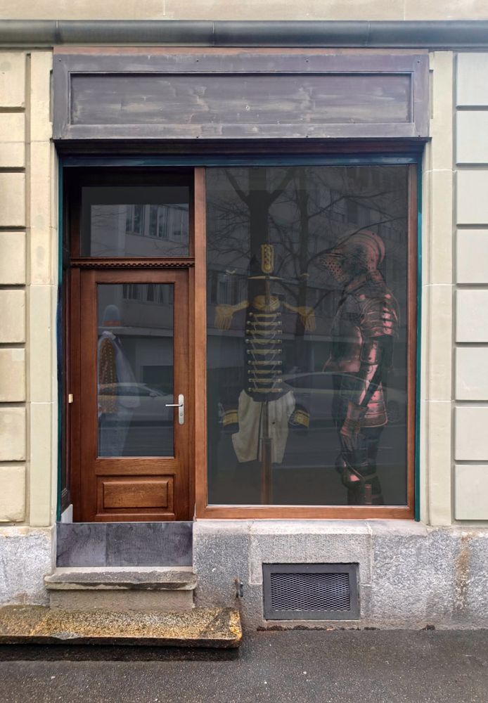 Shopfront resembles the shopfront from Mr Benn. Red Knight, navy uniform etc