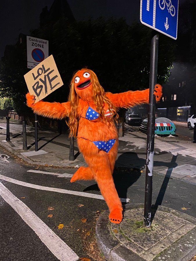 A photo of Grittney holding a sign that says “LOL BYE”
