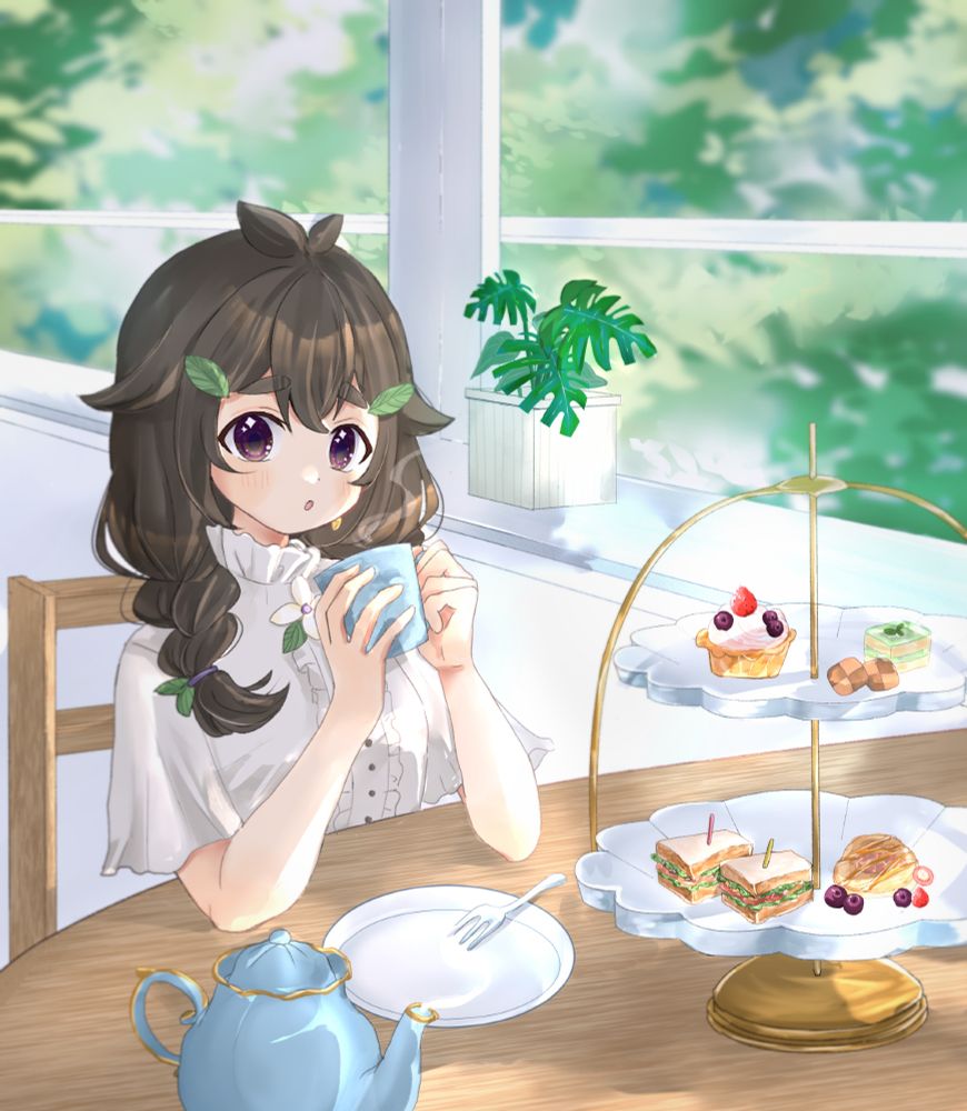 Maggie sitting at a table, enjoying a cup of tea and a tiered tray of sandwiches, scones and desserts.
