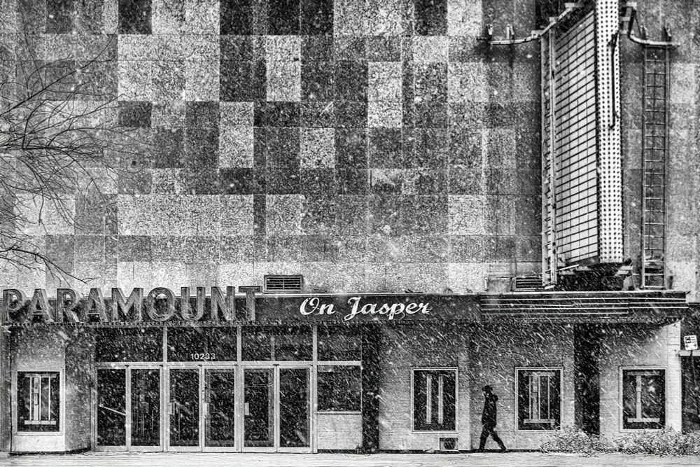 I think saw the first Star Wars movie at this theatre with my father. It was a big deal then. We had pizza before. People were dressed as Wookies in the movie line up. I think I was 11 but who knows...  

The theatre is abandoned now, and there's no more conventional oil, and my Dad is dead. What a sad movie I got to star in. 