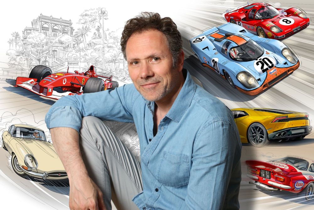 Portrait de Guillaume Lopez, en mode décontracté, petit sourire, manches de chemise retroussées, devant quelques-unes de ses illustrations : F1 Ferrari moderne, Jaguar Type E, Porsche 917, Lamborghini Huracan, Alpine A110...