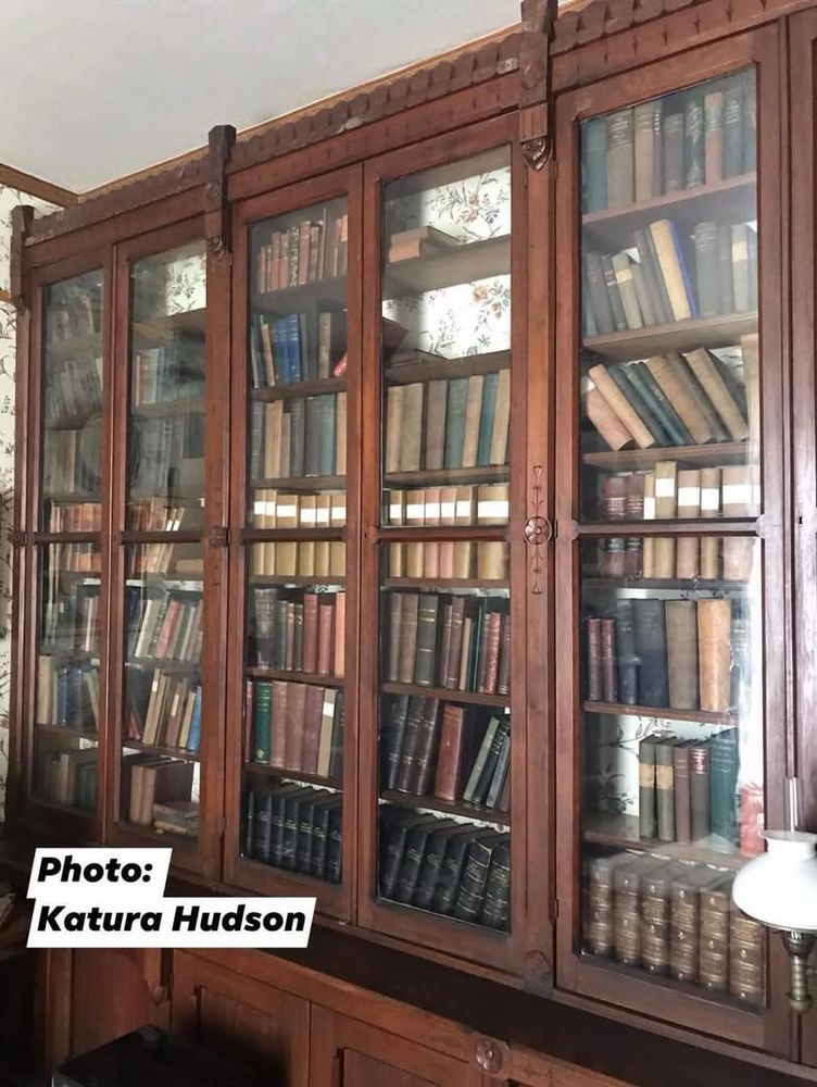 Frederick Douglass’s 2000-book library. Pictured is a wooden and glass bookshelf that spans an entire wall 