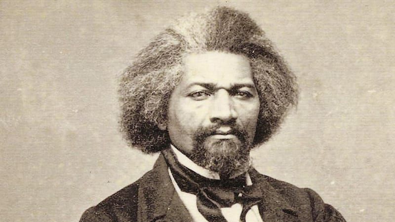 A photo of Frederick Douglass wearing a suit and tie 