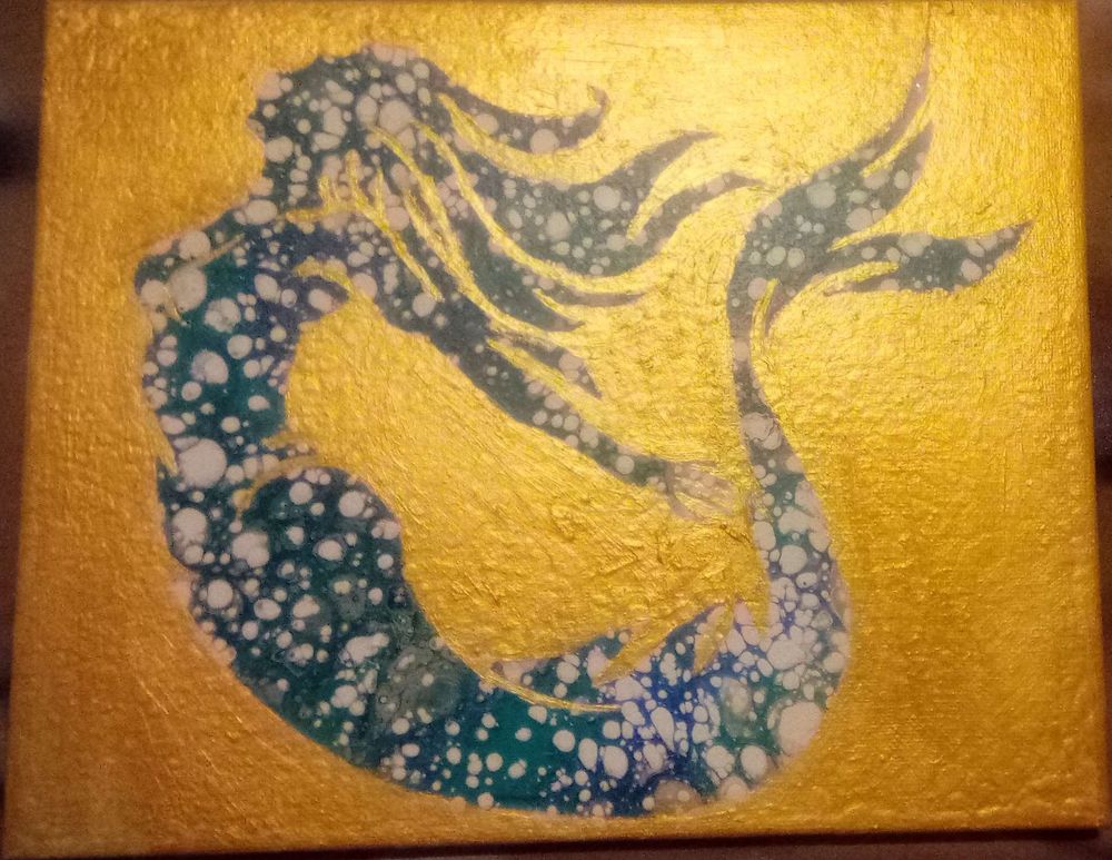 An acrylic painting depicting a mermaid.  She's silhouetted against a shimmering gold background and her body is made of bubbling water.