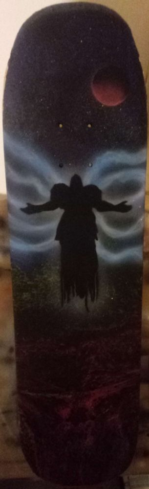A painting on a skateboard deck depicting the character Tyrael from the Diablo video game series
