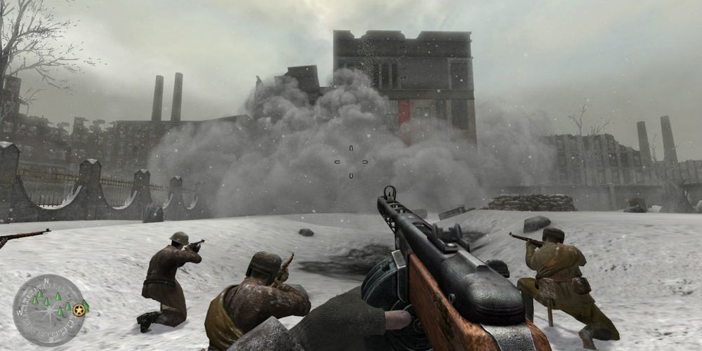 A screenshot from Call of Duty 2 which shows the player controlling a character during the Russian campaign as they watch their forces blow up a building and Nazi position. 