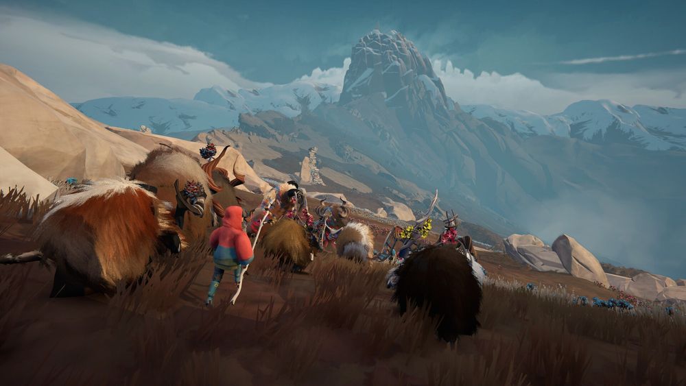 A screenshot from the game Herdling which shows the player, who is wearing a red sweater, herding a pack of mythical creatures on top of a mountain. 